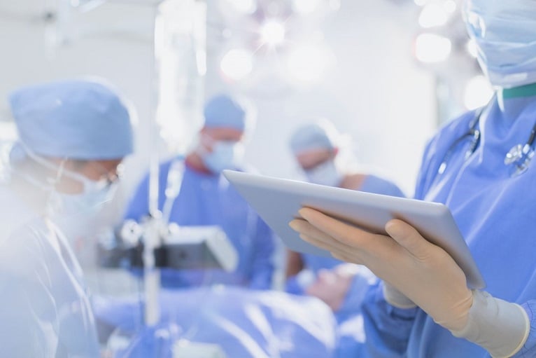 healthcare-medic-on-ward-looking-at-screen-766